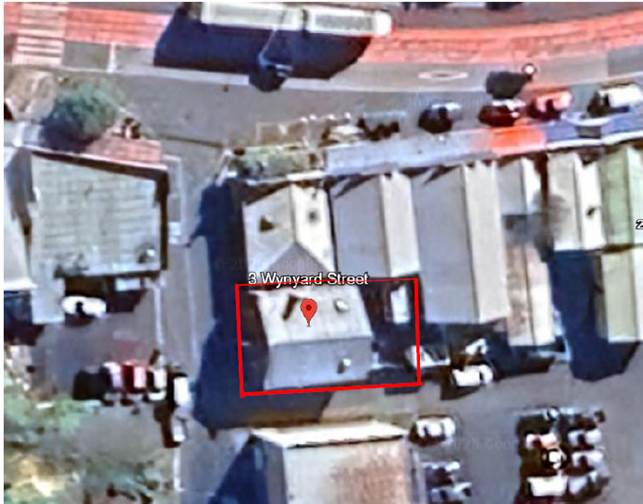 Aerial view of a street with a red square

Description automatically generated